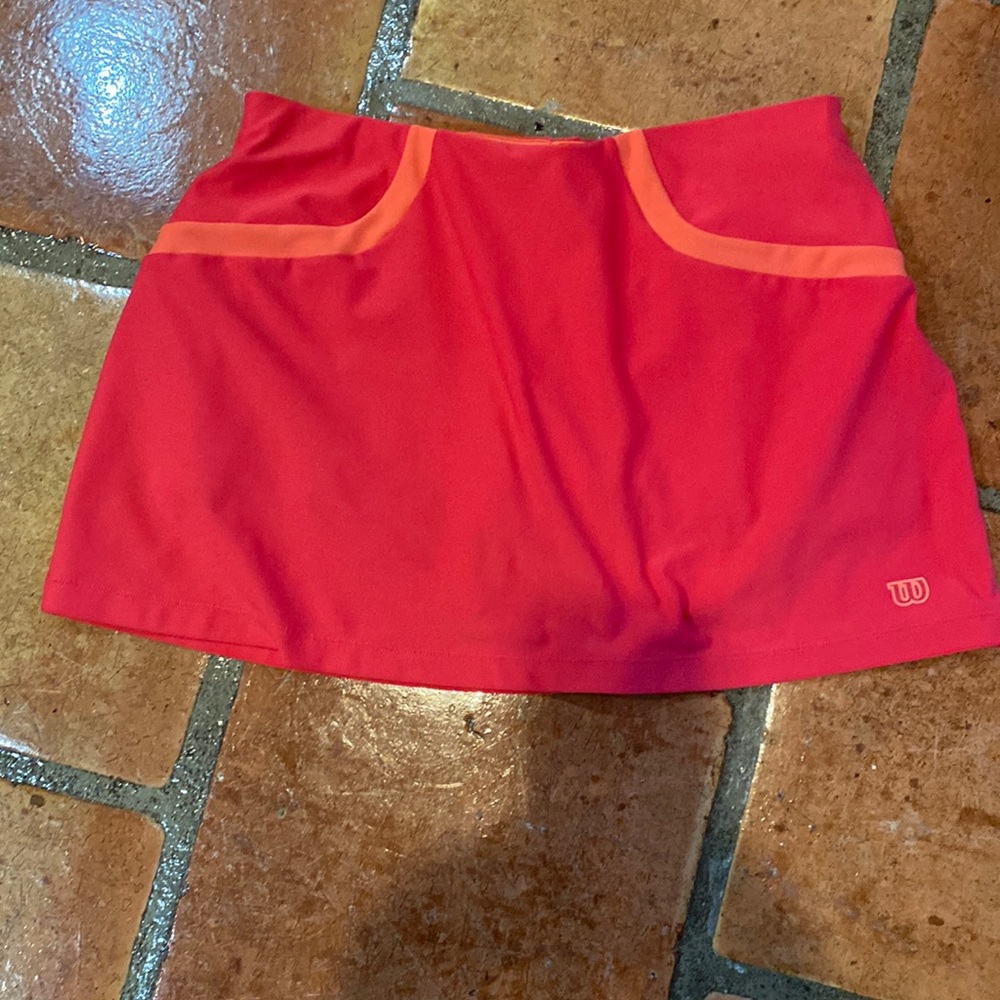 Wilson tennis skirt, pink with orange colored shorts underneath